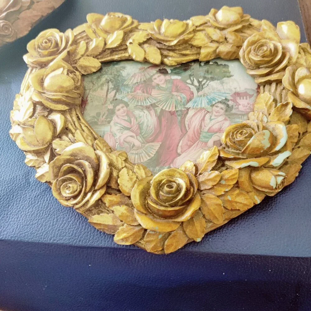 Picture Frames from Nordstroms a heavy gold heart frame with Roses & Leaf Border